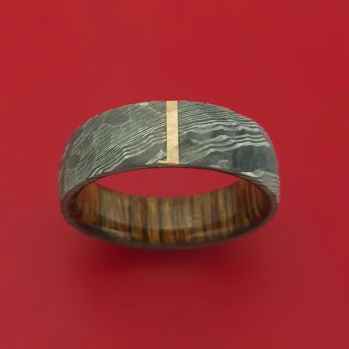 Rings Hammered Damascus Steel Ring with 14k Rose Gold Inlay and Interior Hardwood Sleeve Custom Made Band Lashbrook Rings Hammered Damascus Steel Ring with 14k Rose Gold Inlay and Interior Hardwood Sleeve Custom Made Band Lashbrook