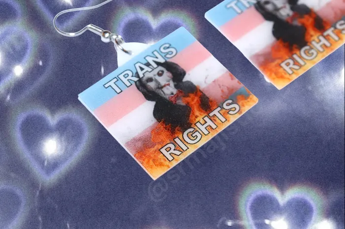 Sam Makes Things Earrings READY TO SHIP Jigsaw Billy the Puppet Saw Character Collection of Flaming Pride Flags Handmade Earrings Sam Makes Things Earrings READY TO SHIP Jigsaw Billy the Puppet Saw Character Collection of Flaming Pride Flags Handmade Earrings