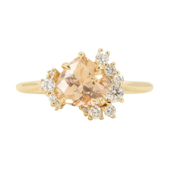 164ct Peach Sapphire and Asymmetrical Diamond Cluster Ring in 14k Yellow Gold Anueva Jewelry Rings 164ct Peach Sapphire and Asymmetrical Diamond Cluster Ring in 14k Yellow Gold Anueva Jewelry Rings