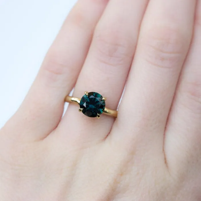 Anueva Jewelry Rings 266 round deep teal blue green sapphire Alluvial solitaire ring in 18k yellow gold