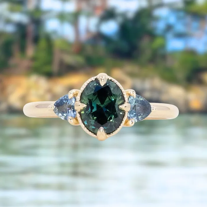 Rings 129ct Oval Deep Teal Green Australian Sapphire and Trillion Sapphire Antique Low Profile Ring in 14k Yellow Gold Anueva Jewelry Rings 129ct Oval Deep Teal Green Australian Sapphire and Trillion Sapphire Antique Low Profile Ring in 14k Yellow Gold Anueva Jewelry