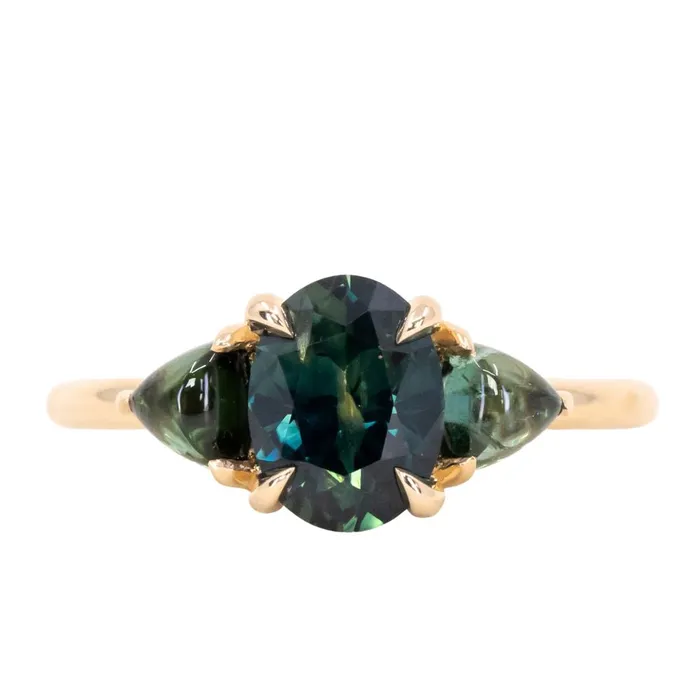 Rings 163ct Oval African Teal Blue Sapphire and Tourmaline Cabochon Trillion Three Stone Ring in 14K Yellow Gold Discovery Gems Rings 163ct Oval African Teal Blue Sapphire and Tourmaline Cabochon Trillion Three Stone Ring in 14K Yellow Gold Discovery Gems