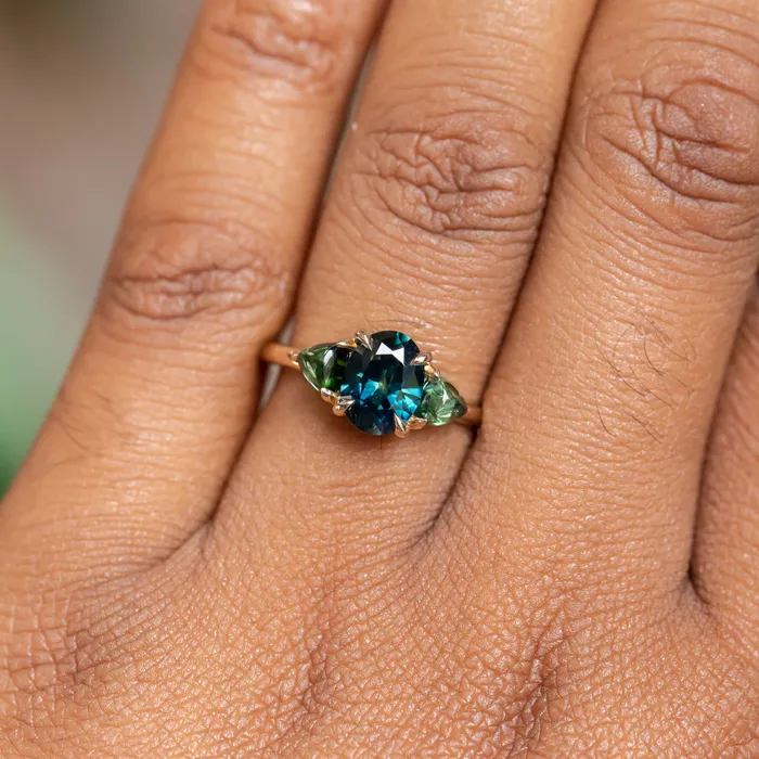 Rings 163ct Oval African Teal Blue Sapphire and Tourmaline Cabochon Trillion Three Stone Ring in 14K Yellow Gold Discovery Gems