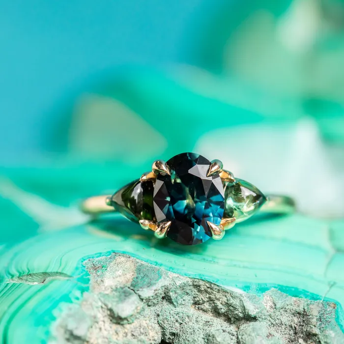 Rings 163ct Oval African Teal Blue Sapphire and Tourmaline Cabochon Trillion Three Stone Ring in 14K Yellow Gold Discovery Gems