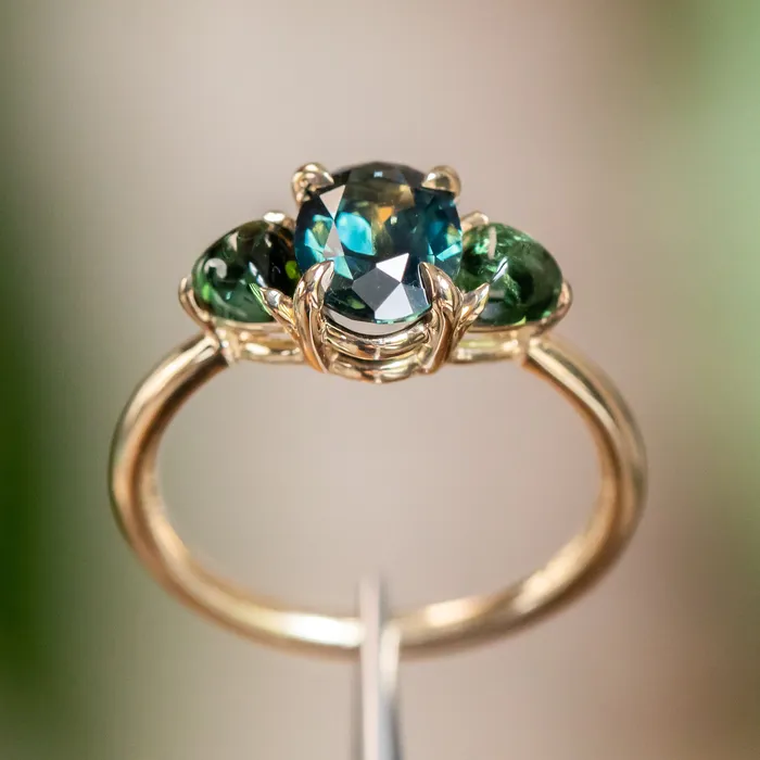 Rings 163ct Oval African Teal Blue Sapphire and Tourmaline Cabochon Trillion Three Stone Ring in 14K Yellow Gold Discovery Gems