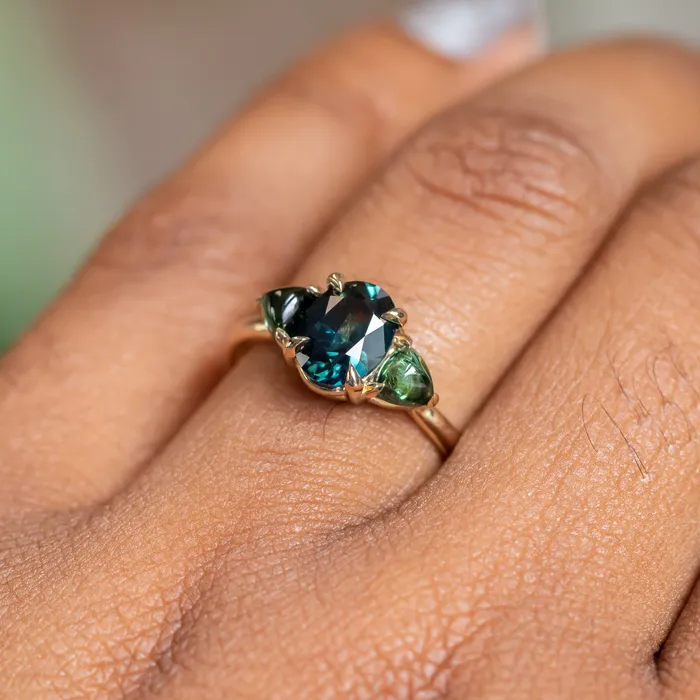 Rings 163ct Oval African Teal Blue Sapphire and Tourmaline Cabochon Trillion Three Stone Ring in 14K Yellow Gold Discovery Gems