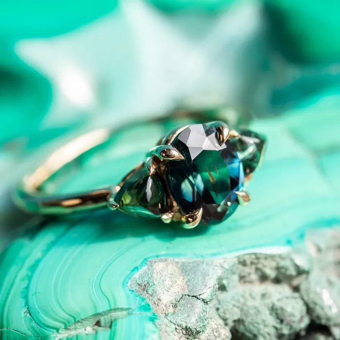 Rings 163ct Oval African Teal Blue Sapphire and Tourmaline Cabochon Trillion Three Stone Ring in 14K Yellow Gold Discovery Gems